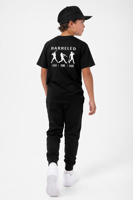 Model wearing the youth BARRELED premium baseball t-shirt by Rake City.
