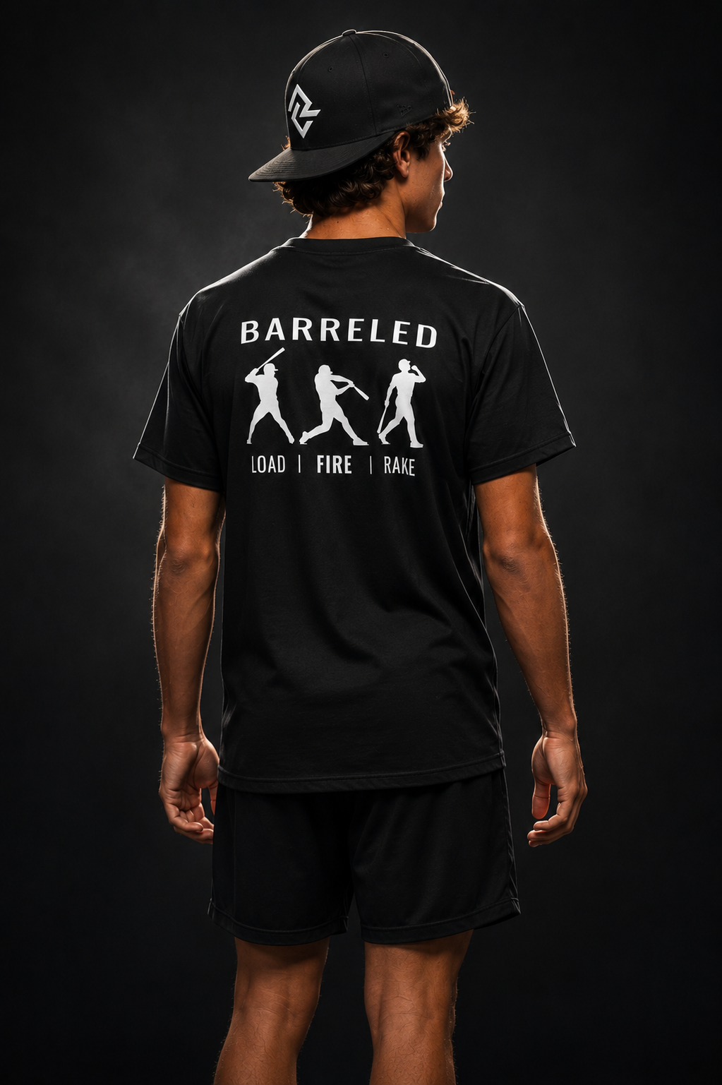Model wearing the BARRELED premium baseball t-shirt and RC snapback by Rake City.