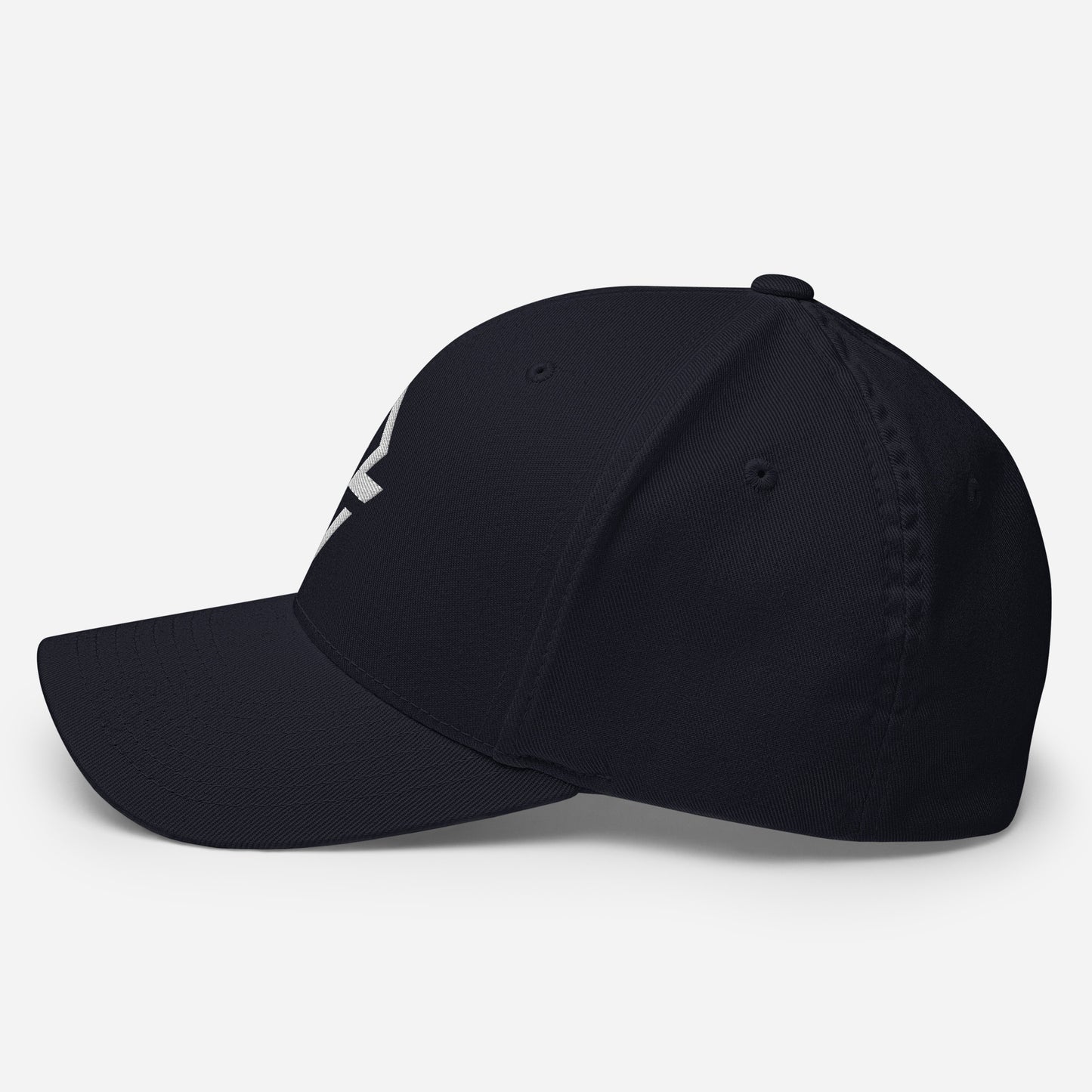 Profile view of the navy flexfit baseball hat by Rake City.
