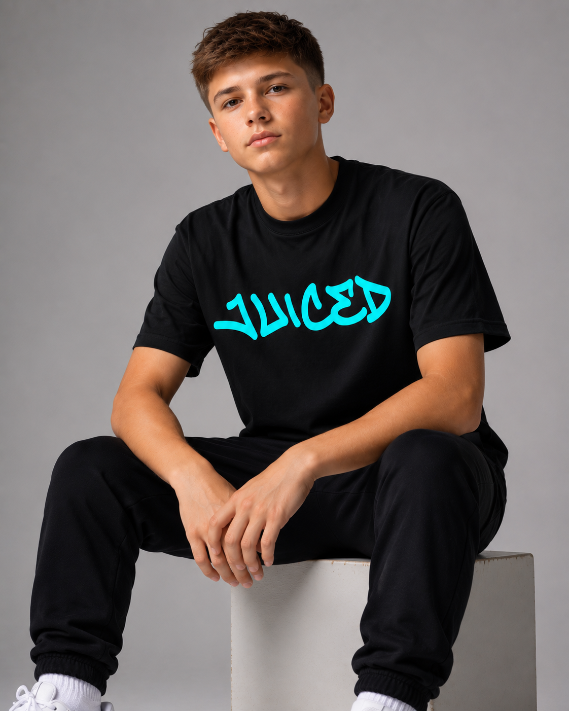 Model wearing the JUICED premium baseball t-shirt by Rake City.