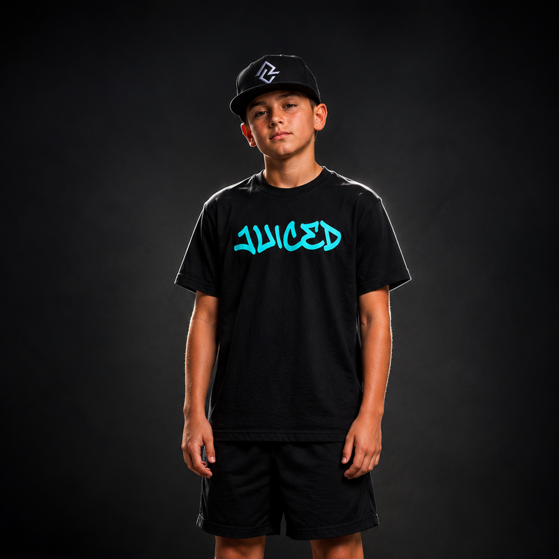 Model wearing the JUICED premium baseball t-shirt and black Rake City RC snapback hat.