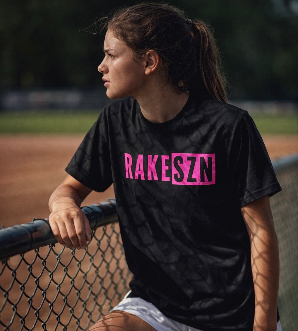 Model wearing the pink RAKESZN premium baseball t-shirt by Rake City.