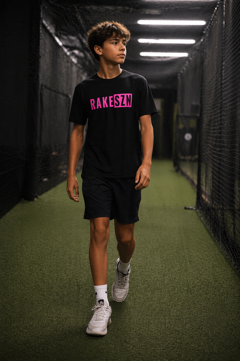 Model wearing the pink RAKESZN premium baseball t-shirt by Rake City.