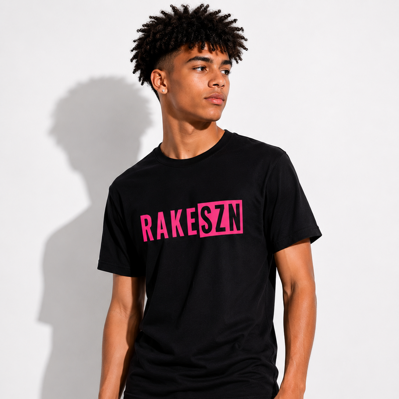 Model wearing the pink RAKE SZN premium t-shirt by Rake City.