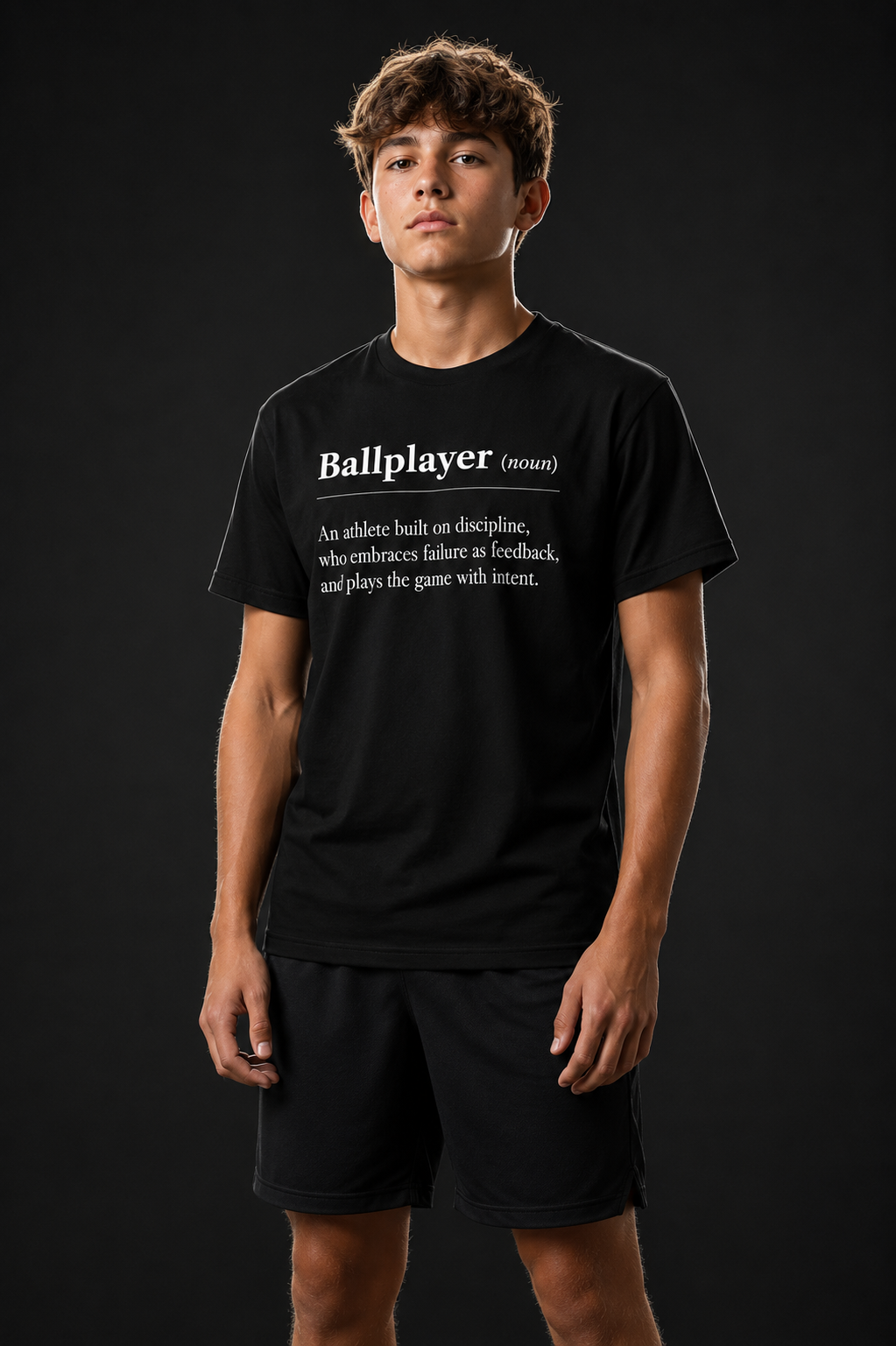 Model wearing the youth BALLPLAYER premium baseball t-shirt by Rake City.