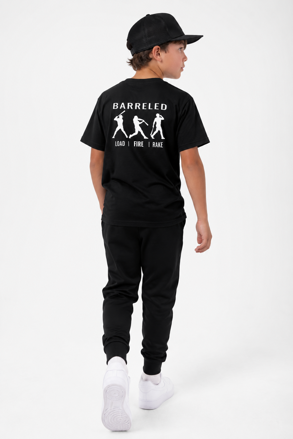 Model wearing the youth BARRELED premium baseball t-shirt by Rake City.