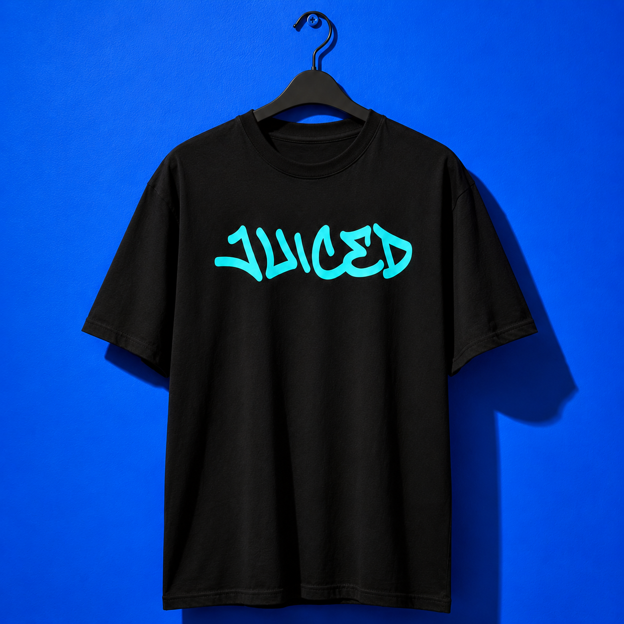 Hanger view of the youth JUICED premium baseball t-shirt by Rake City.